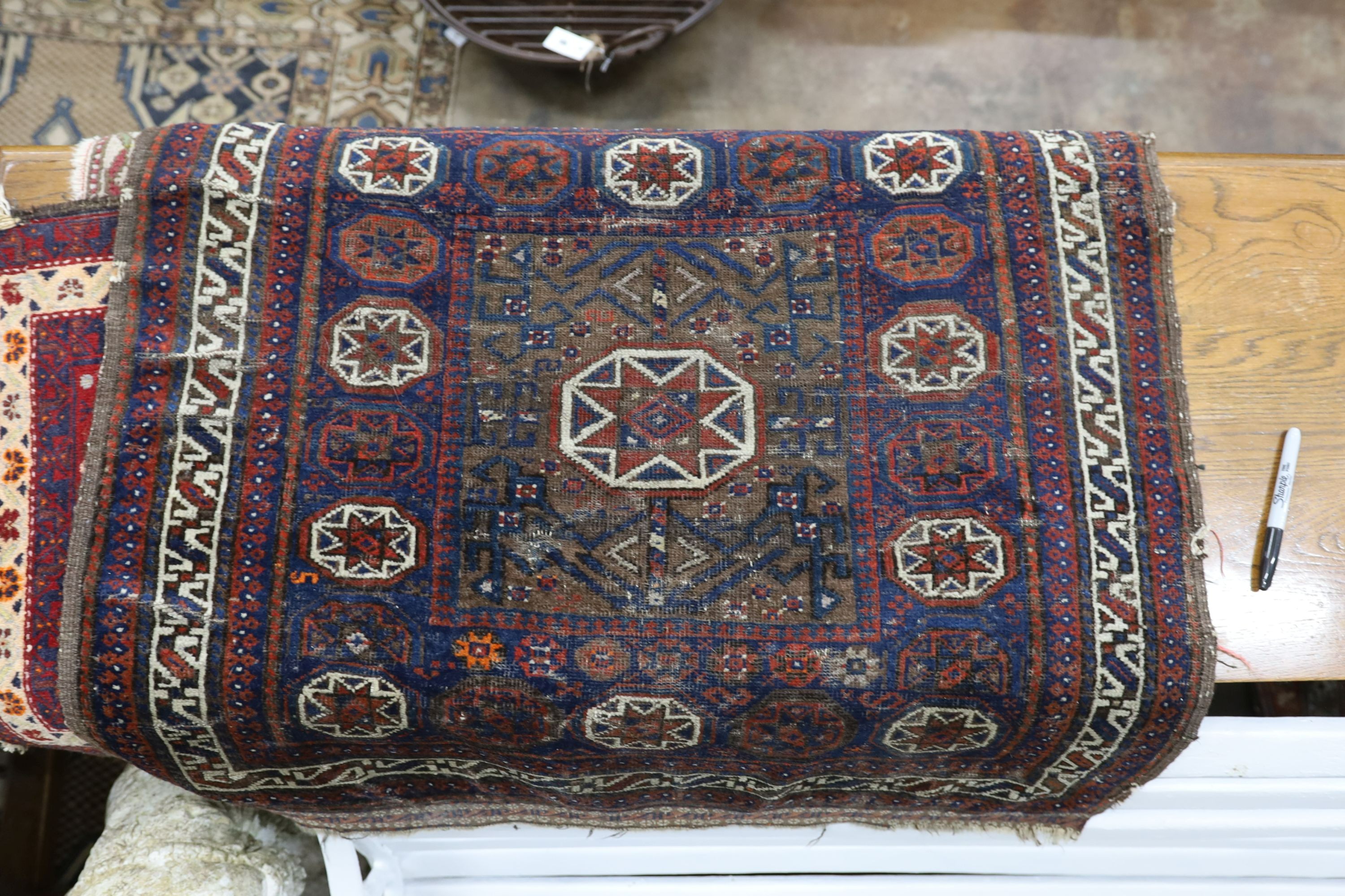 Four Caucasian and North West Persian mats, largest 87 x 88cm